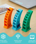 Badass Teal Petg 3D Printer Filament 2.85Mm 1Kg Spool with orange, blue, and green filament holders on a desk.