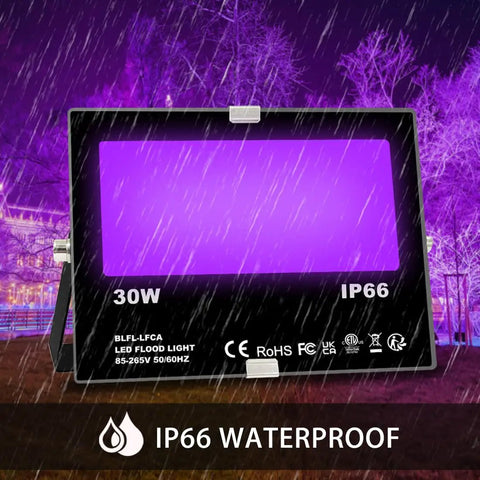 Top Shelf 30W LED Blacklight Flood Lights 6 Pack Heavy Duty IP66 Waterproof Fixtures showing purple glow in rain.