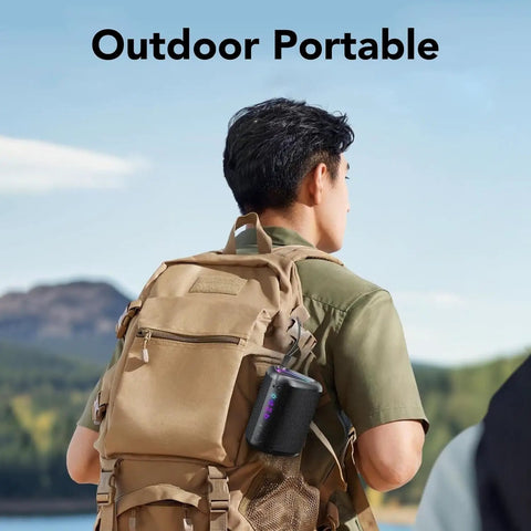 Man hiking with Portable Bluetooth Speaker With Led Light And Outdoor Ready Design Delivers Deep Bass And Beast Mode Power With 24 Hour Playtime IPX7 Waterproof Attached To Backpack