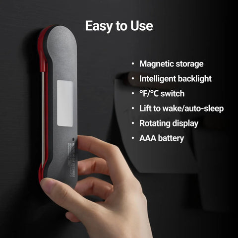 Hand placing Lightning Fast Digital Meat Thermometer With A 0.6 Second Read And PlusMinus0.5F NIST Certified Accuracy on magnetic surface.