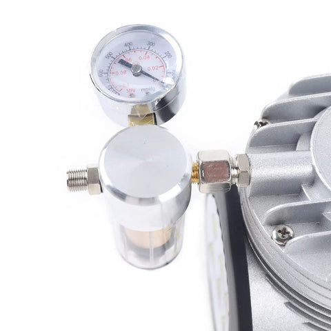 Pro Grade Oil Free Diaphragm Vacuum Pump Delivering Tough Build And Whisper Quiet Operation With One Sixth Horsepower Motor for food packaging and lab tasks, pressure gauge and filter close-up.
