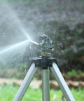 Heavy Duty Impact Sprinkler On Tripod Base With Extra Tall Pulsating Metal Sprinkler for Large Yards and Gardens Telescoping Legs Waters Up To 90 Ft Diameter Durable Tripod System in action on grass