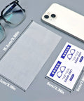 Pre Moistened Lens Wipes For Glasses And Screens 220 Individually Wrapped Eyewear Cleaners positioned next to glasses and phone