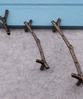 Hella Stylish Tree Twig Cabinet Knobs 6 Pack Bronze Zinc Alloy Drawer Pulls Solid Build For Mountain Cabin Kitchen Cupboard Single Hole Hardware With Screws, varying twig designs.