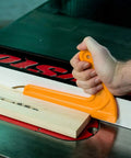 Solid L Shape Wood Push Sticks, Kickback Killer Table Saw And Router Table Guide, reliable orange grip push stick in use.
