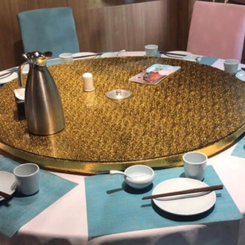 Rides Smooth Across Any Dining Surface This Rechargeable Electric Lazy Susan Turntable on a gold table setting.