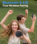 Two people enjoying music with Round One Bluetooth Speaker With IPX8 Waterproof Shower Rating And Loud HD Sound outdoors