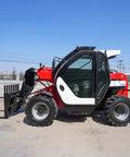 Versatile Telescopic Handler With Quick Attach System And Enclosed Brake For Warehouses Farms Or Industrial Job Sites side view