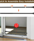 Heavy Duty Door Security Bar Locks It Down Tight Extends To Fifty Five Inches Portable Sliding Door Stopper and Top Shelf Home Safety Jammer For Apartments And Hotels Travel Black installed in a door frame.