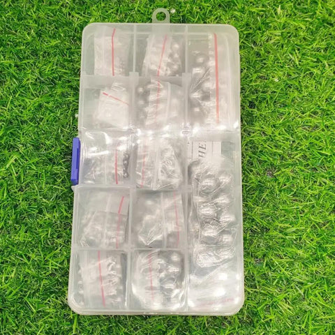 Assorted Full-Size Precision Steel Balls Set With Storage Box For Bicycle And Machinery, 530 Pieces, on grass background