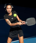 Person playing pickleball with GX2 Hyper Pickleball Paddle With Aerodynamic Hyper Shape And SST 2.0 Carbon Core For Explosive Speed Spin And Precision