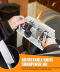 Small Belt Grinder Knife Jig Adjustable Angle Beveling Locator Crafted From Durable Aluminum Alloy Frame Killer Edge Sharpening Guide on a belt grinder with hands adjusting the blade angle.