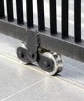 Badass Heavy Duty 2 Pack Sliding Gate Track Rollers 1.89 Inch Wide Body U Groove Wheels with 3000 Lb Load Rating installed on gate.
