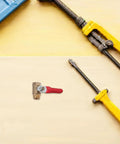 Tough As Nails Four Inch Mini Ball Valve With Slick Lever Handle on wood surface with tools, designed for plumbing and garden hose use.