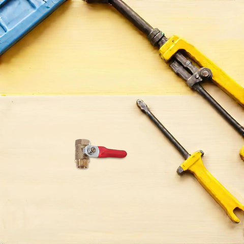 Tough As Nails Four Inch Mini Ball Valve With Slick Lever Handle on wood surface with tools, designed for plumbing and garden hose use.