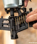 Loading one and a quarter inch pneumatic roofing nails 7,200 count electro galvanized into wire coil roofing nailer