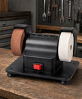 Badass Dual Wheel Bench Grinder With Sturdy Rubber Footed Base on wooden table, showcasing brown and white grinding wheels.