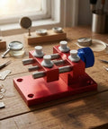 Aluminum Work Holder With Threaded Tightening Screw And Two Sliding Clamps Rock Solid Red Anodized Finish Heavy Duty Workshop Tool For Precise Part Holding And Repair on workbench