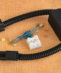 Solid VCM Bypass Harness And Resistor Plug Set For 3.5L V6 Engine, wiring components and connectors on a textured background.