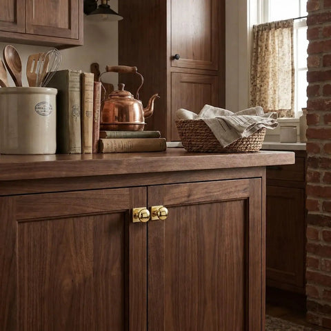10 Pack 1-1/4 Inch Vintage Aged Polished Brass Backplate For Cabinet Knobs And Drawer Handles Heavy Duty Zinc Alloy Furniture Hardware Go Big With Slick Top Shelf Durability in a rustic kitchen setting with wooden cabinets.