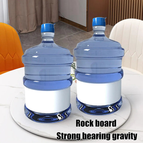 Large Marble Lazy Susan Turntable Rotating Serving Plate For Countertops And Dining Tables with two water jugs on top.