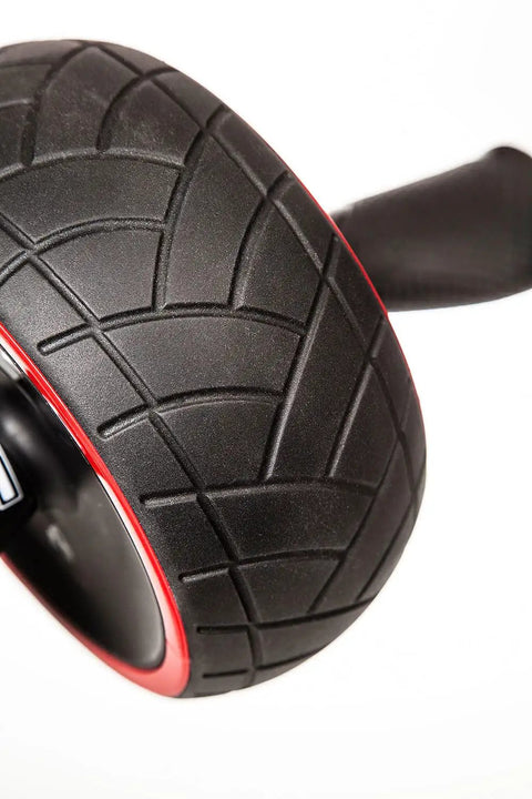 Killer Ab Rocker And Complete Core Toning Setup featuring heavy duty, wide non-slip wheel with textured tread pattern.