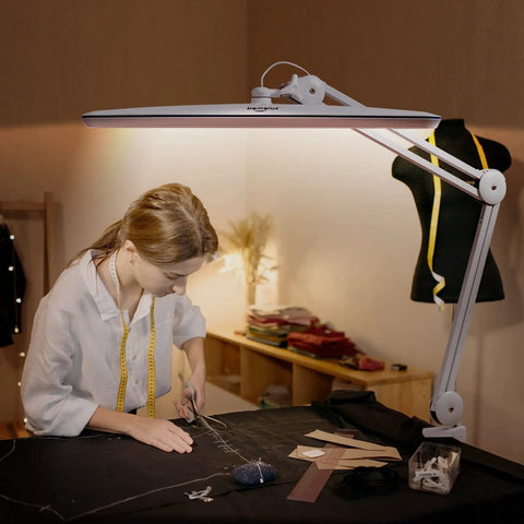 Task Lamp With Clamp For Desk Or Workbench 23 Inch Wide Head 117 LEDs 24W 2200 Lumen Dimmable Swing Arm Light in sewing room