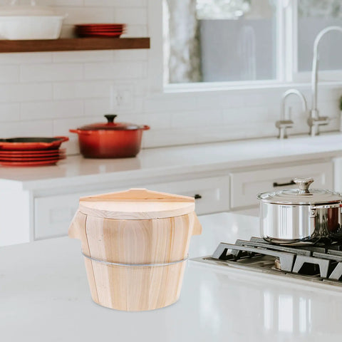 Built Tough Wooden Rice Steamer Bucket With Secure Lid And Sturdy Handles For No Sweat Steam Cooking And Hassle Free Drain Cleanup On Any Modern Home Kitchen Shelf on a counter.