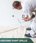 Man using rugged cotton duck drop cloth for painting protection, washable 8x10 ft canvas tarp, floors and furniture shielded