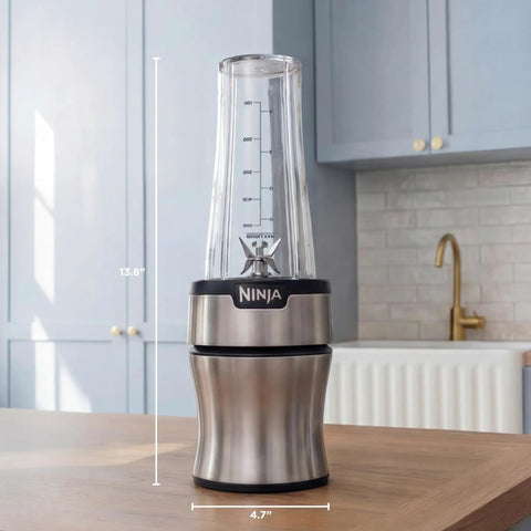 Heavy Duty Personal Blender Featuring 900W Push To Blend Motor And Pro Extractor Blades Crushing Ice For Nutrient Dense Smoothies Including Three Grab And Go 20 Oz Serveware Cups In Classic Silver, measuring 13.8" height and 4.7" width.