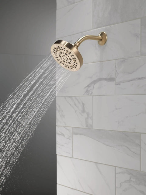 5-Setting Champagne Bronze Shower Head With High Pressure Spray And Pause Setting 6 Inch Round 1.75 GPM Flow Water Saving Full Body Power Showerhead For Modern Bathrooms installed on tile wall