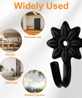 Heavy Duty Retro Flower Wall Hooks Eight Pack Slick Vintage Decorative Hardware Holds Up A Ton Absolute Game Changer For Scarves Towels Keys And Bags Badass Black Iron Wall Mount Clip shown in various settings.