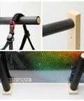 Handcrafted Natural Wood Wall Mount Skateboard Rack Holds Three Longboards And Snowboards Featuring Protective Cushioned Sleeves close up view of black padded holders