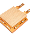 Rock Solid CNC Workpiece Positioning Fixture Kit With T Slot Perforated Table And Hella Accurate Woodworking Vise Clamps, featuring wooden base and orange aluminum mounts.
