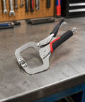 Heavy Duty Locking Clamp Plier 14 Inch With Adjustable Screw For A Beefy Non Slip Grip And Precise Holding Built For Repeated Repairs Home Improvements And Workshop Projects Delivering Fast Reliable Lockdown Power, steel plier on workbench