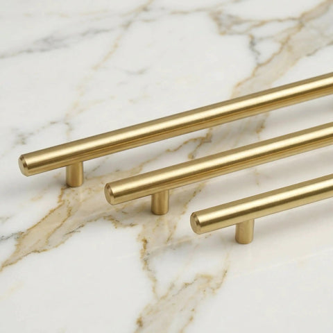 Heavy Hitter Solid Stainless Steel Bar Handles 25 Pack Euro Style Cabinet Pulls With Killer Brushed Satin Gold Brass Finish on marble background.