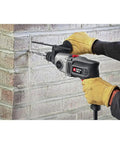 Heavy Duty Hammer Drill Half Inch 7 Amp Dual Speed Built For Tough Jobs In Concrete Wood And Metal With Cast Metal Gear Housing in use