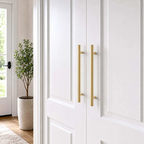 Real Deal 5 Pack Solid Brass Cabinet Pulls Featuring A Stunning Brushed Gold Finish That Delivers Badass Durability And Zero Rust Hassle While Giving Your Cabinets A Major Glow Up Using Simple 6 1 4 Inch Mounting Spacing, shown on white cabinet doors.