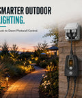 Built Tough Outdoor 24 Hour Light Timer With Photocell Dusk To Dawn Sensor setup against a garden wall, evening lights glowing.