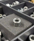 Four Piece One Way Needle Roller Bearings 8Mm Inner 14Mm Outer Silent Steel Clutch For Gym Equipment Fitness Machines Smooth Operation Zero Drag Heavy Duty Rollers Plug And Play Rock Solid Replacement Parts in a storage organizer.