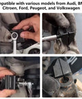 Universal Suspension Strut Spreader Tool With Double Ended Hub Clamp in use for vehicle strut removal and knuckle separation