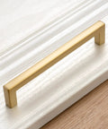 Top Shelf 10 Pack Brushed Gold Cabinet Pulls 5 Inch Square Bar Drawer Handles on white cabinet surface.