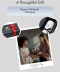 Two people exchanging a gift box with elegant gift-ready packaging, featuring red and black ribbon details.