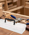 Heavy Duty Tool Box With Slick Divided Compartments And Secure Lid for organizing tools and screws on a workbench.
