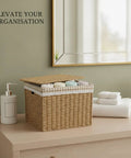 Slick Heavy Duty Flip Top Storage Bin For Closets And Bathroom Vanities To Dodge Dust And Keep Dailies Nice And Tidy With Secure Lid displayed on dresser with towels.