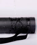 Bulletproof Extendable Poster Storage Tube With Quick Grip Straps And Easy Peasy Adjust From 24 To 40 Inches For Blueprints Artwork Maps And Rolled Posters In Matte Black Case, wet with water droplets.