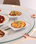 Round Lazy Susan Tempered Glass Turntable Runs Buttery Smooth Heavy Duty Slick Construction Crystal Clear Finish Total Game Changer For Family Dinners And Modern Kitchen Tables 35 To 39 Inches Wide with dishes being served.