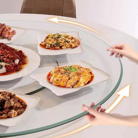 Round Lazy Susan Tempered Glass Turntable Runs Buttery Smooth Heavy Duty Slick Construction Crystal Clear Finish Total Game Changer For Family Dinners And Modern Kitchen Tables 35 To 39 Inches Wide with dishes being served.