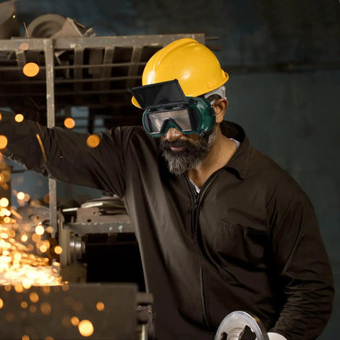 Job Site Tough Flip Up Welding Safety Glasses With Vented Anti Fog Shell Double Layer Shatterproof Lenses For Stick Mig Argon Cuts And Everyday Shop Grinds 2 Pack worn by a worker with yellow helmet.