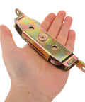Heavy Duty Twin Roller Sliding Door And Window Pulley Replacement With Tandem Metal Wheels, shown in hand for size perspective.